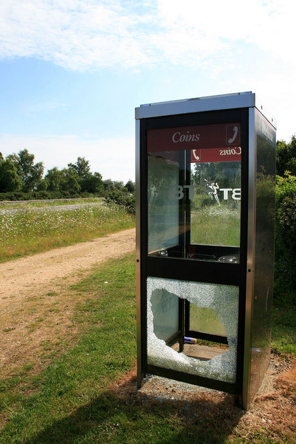 Phone box with broken glass
