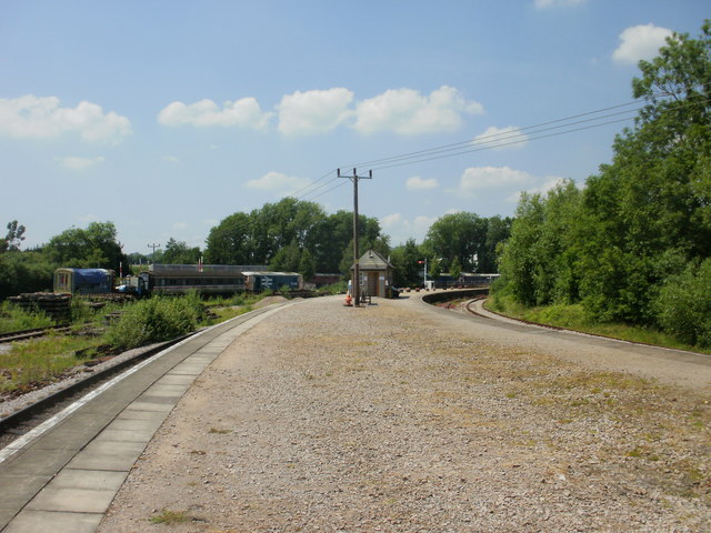 Power lines cross Lydney Junction railway station