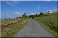 SN9090 : Minor road heading for Llawr-y-glyn by Nigel Brown