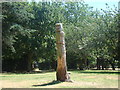 Wood-carved totem pole in Lodge Farm Park