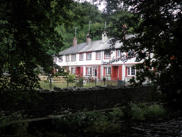 Terrace of houses, glimpsed from east of the river, at Okehampton
