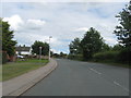 NY3250 : Road heading in to Thursby in Cumbria by James Denham