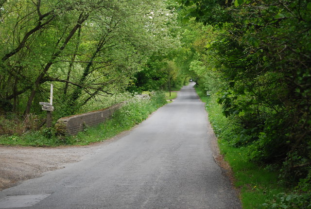 Road crosses the old railway, Chailey Common