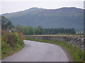 Graceful curve of the B846 Road flanked by drystane dyke