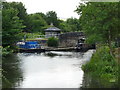 Barge (left) emerging from Brookfoot Lock