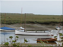 TF8444 : Boats moored at Burnham Overy Staithe by Sarah Charlesworth
