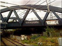 TQ2984 : Graffiti on a railway bridge near Kentish Town by Andrew Abbott