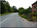 Withington Hall milepost in its setting