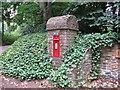 Stone clad Edward VII postbox on the corner of the B2130