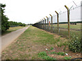 Lane along perimeter fence