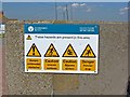 Hazard warning by the seafront