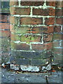 Benchmark on wall pier of Nuffield House Day Centre, Claremont Road