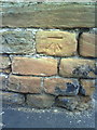 Benchmark on Gladstone Street wall