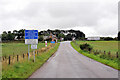 Warning signs approaching the level crossing near Allanfearn