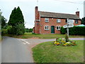 Floral road sign at The Lottery 2