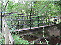 NY9357 : Footbridge over Devil's Water by Les Hull