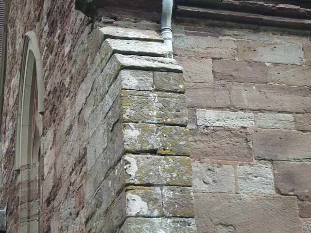 Old sundial on south wall of Madley church