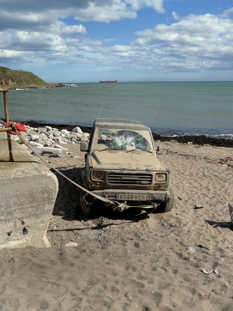 Abandoned Car tethered to the Nigg Breakwater