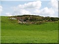 Old quarry used as rubbish tip.