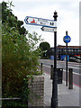 Sign to Riverside Walk and Thames Path, London SW8