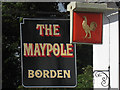 The Maypole sign