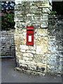 Benchmark on wall pier at junction of Bath Street and footpath