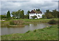 Lake and farmhouse, Clayworth Woodhouse