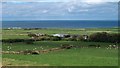 Farm buildings and parish church at Penllech