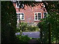 Footpath arrives at Strawberry Lane in Up Somborne