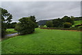 Grassy field between the River Severn and the A470