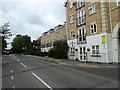 Looking past Crossley Place towards the traffic lights at the western end of Milton Road