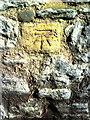 Benchmark on wall of Abbey Close