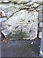 Benchmark on wall at north end of Bath Street