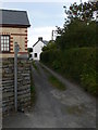 Access and footpath going west in Commins Coch