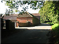 Lane past barns at West Barsham Hall