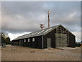 Barn and mobile phone towers near Port Farm