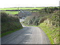 The descent of the Uwchmynydd road towards Pont Afon Saint bridge and crossroads