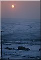 Sun over Hoyle Dean in snow