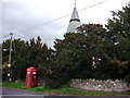 Old red telephone box next to Llanelly church