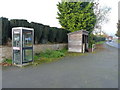 Phone box and bus stop in Wall under Heywood