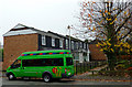 Lady Taverners bus by recent housing in Blakenhall