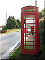 TM1893 : K6 telephone box in Forncett Road. Tharston by Evelyn Simak