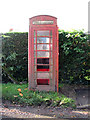 TM1893 : Vandalised K6 telephone box by the junction of Forncett Road and Picton Road by Evelyn Simak