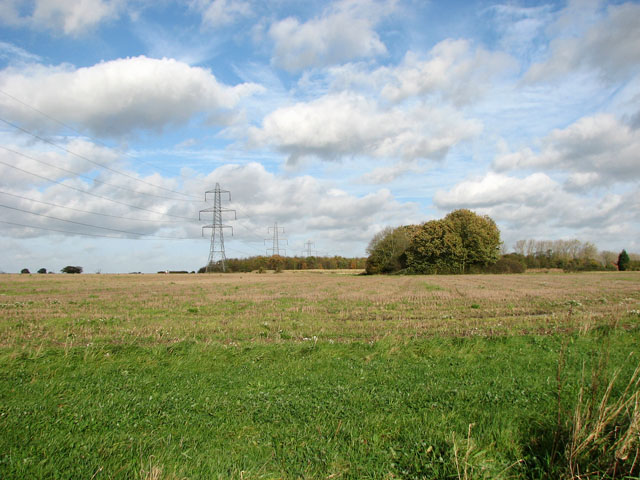 Electricity pylons in stubble field west of Tivetshall St Mary