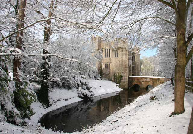 Boarstall Tower and the moat in the snow