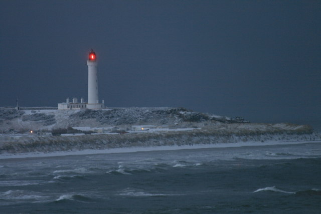 A flash from the Covesea Light on a wintry day