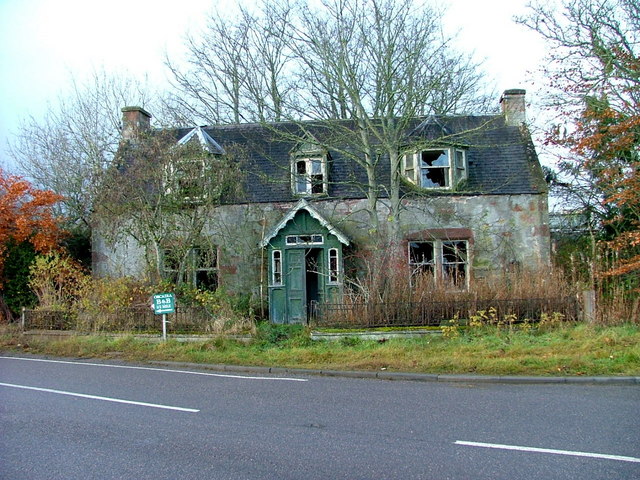 Dilapidated house at the crossroads