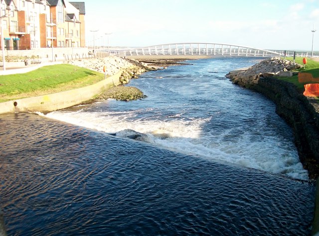 The weir and footbridge at the estuary of the Shimna River
