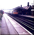 A Class 33 locomotive passes through Goring-on-Sea Railway Station