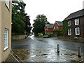 Approaching the junction of Denne Road and Normandy